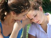 Adult comforting adolescent